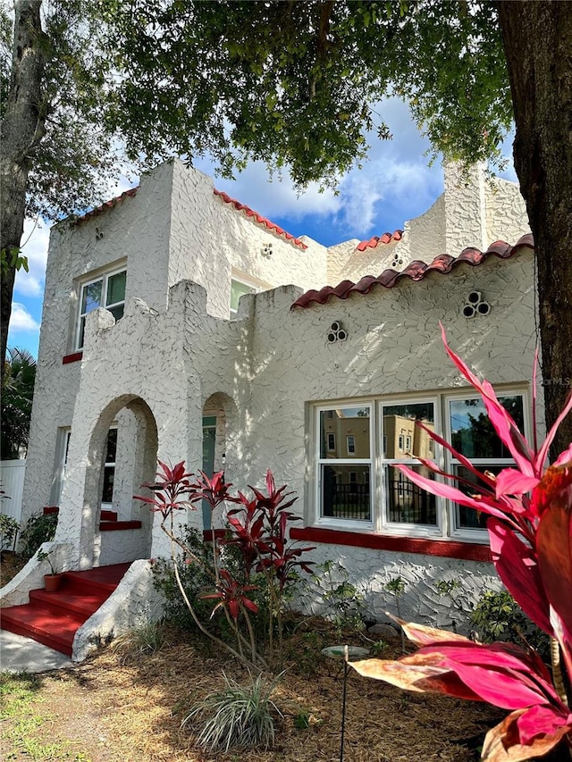 1020 38th Ave N, Saint Petersburg, FL 33704 - back of house featuring stucco siding