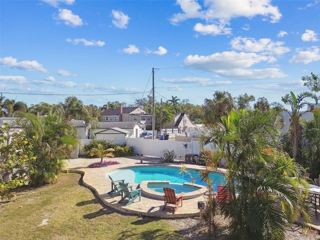 1020 38th Ave N, Saint Petersburg, FL 33704 - view of pool featuring a patio area, a fenced backyard, and a pool with connected hot tub