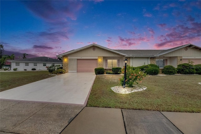 339 Club Manor Dr, Sun City Center, FL 33573 - single story home with driveway, a garage, and a lawn