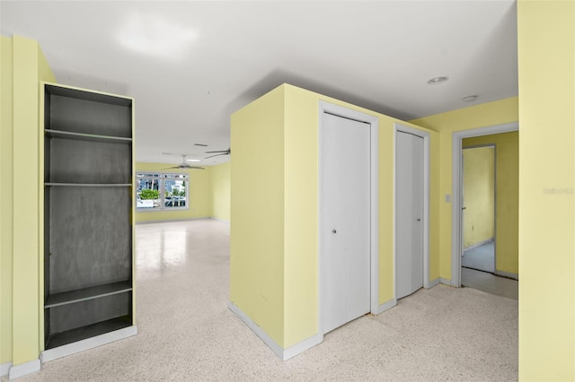3932 Shore Acres Blvd NE, Saint Petersburg, FL 33703 - corridor featuring baseboards and speckle patterned floor
