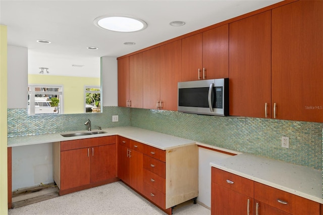 3932 Shore Acres Blvd NE, Saint Petersburg, FL 33703 - kitchen featuring stainless steel microwave, a sink, decorative backsplash, light countertops, and recessed lighting