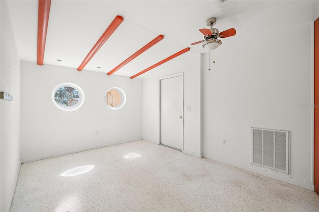 3932 Shore Acres Blvd NE, Saint Petersburg, FL 33703 - spare room with speckle patterned floor, ceiling fan, and baseboards
