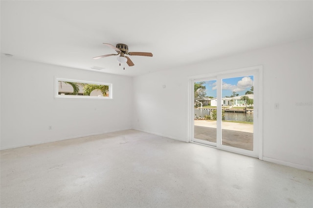 3932 Shore Acres Blvd NE, Saint Petersburg, FL 33703 - unfurnished room with a water view, ceiling fan, and baseboards