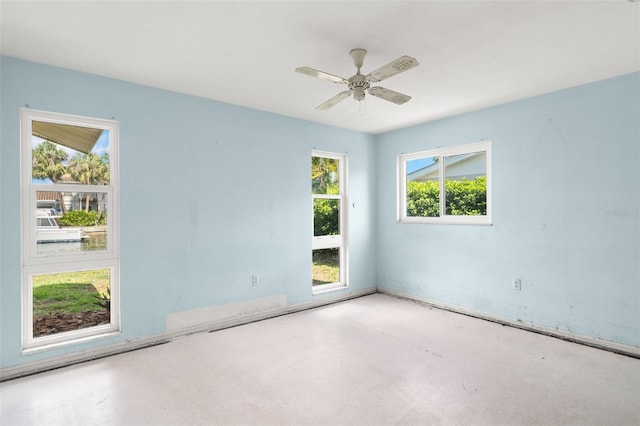 3932 Shore Acres Blvd NE, Saint Petersburg, FL 33703 - unfurnished room featuring concrete floors and ceiling fan