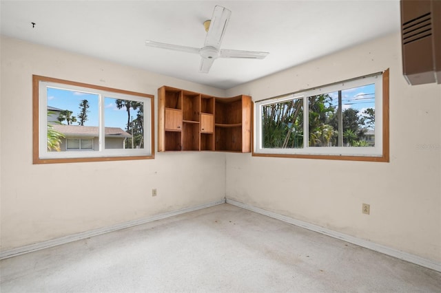 3932 Shore Acres Blvd NE, Saint Petersburg, FL 33703 - empty room with baseboards and a ceiling fan