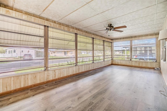 3542 Castle Dr, Zephyrhills, FL 33540 - unfurnished sunroom featuring ceiling fan and wood finished floors