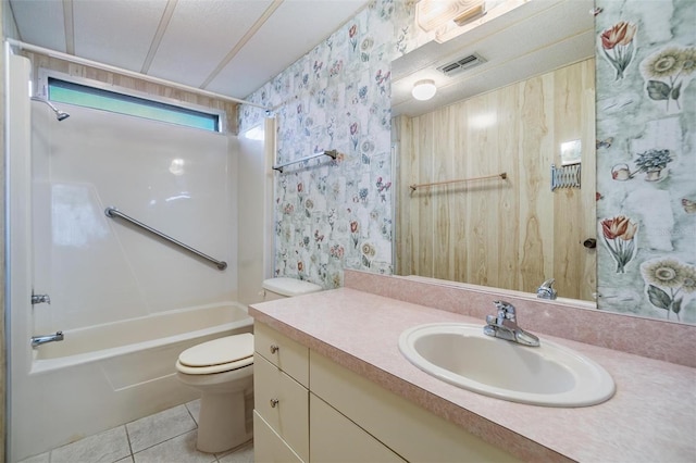 3542 Castle Dr, Zephyrhills, FL 33540 - full bathroom with tile patterned flooring, toilet, vanity, shower / tub combination, and wallpapered walls