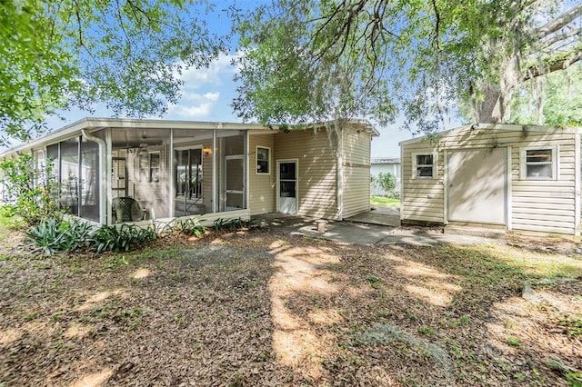 3542 Castle Dr, Zephyrhills, FL 33540 - rear view of house featuring a sunroom