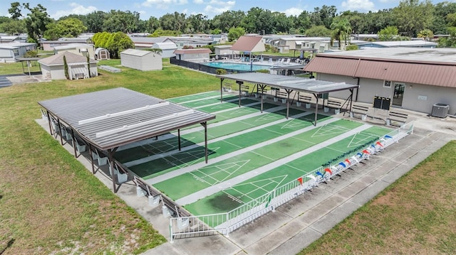 3542 Castle Dr, Zephyrhills, FL 33540 - view of community with shuffleboard and a yard