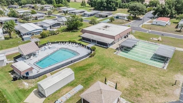 3542 Castle Dr, Zephyrhills, FL 33540 - aerial perspective of suburban area featuring a pool area