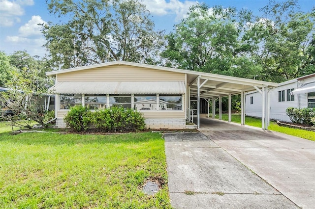 3542 Castle Dr, Zephyrhills, FL 33540 - manufactured / mobile home featuring a front yard and concrete driveway