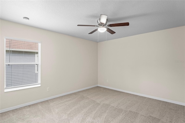 7249 Bridgeview Dr, Wesley Chapel, FL 33545 - unfurnished room featuring carpet, ceiling fan, a smoke detector, and a textured ceiling