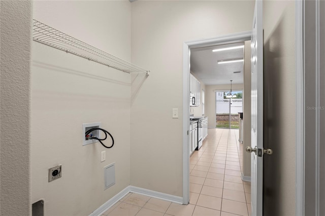 7249 Bridgeview Dr, Wesley Chapel, FL 33545 - laundry room with hookup for an electric dryer, washer hookup, and light tile patterned floors