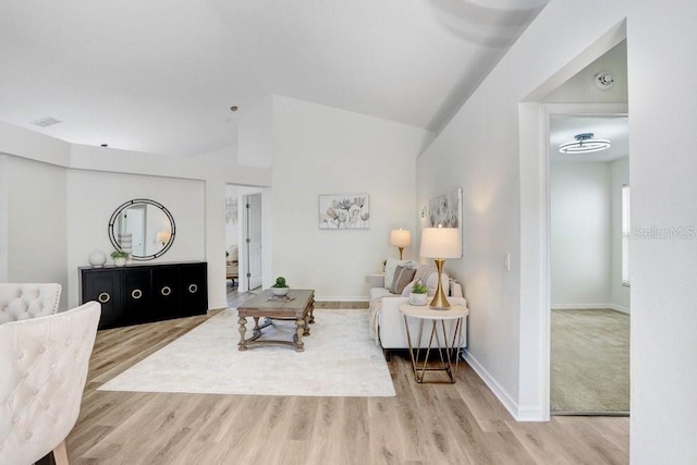 4921 Wessex Way, Land O Lakes, FL 34638 - living room featuring wood finished floors, baseboards, and vaulted ceiling