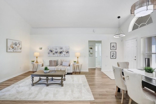 4921 Wessex Way, Land O Lakes, FL 34638 - living room with light wood-type flooring, baseboards, and lofted ceiling