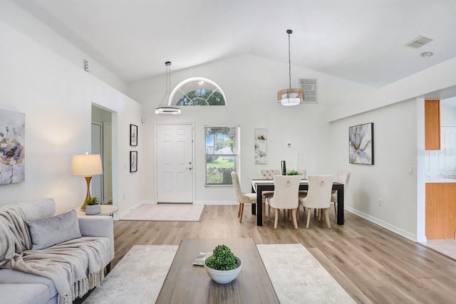 4921 Wessex Way, Land O Lakes, FL 34638 - living room with light wood-style flooring, baseboards, and high vaulted ceiling