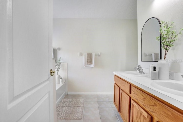 4921 Wessex Way, Land O Lakes, FL 34638 - full bath featuring double vanity, a garden tub, tile patterned flooring, and baseboards