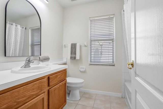 4921 Wessex Way, Land O Lakes, FL 34638 - bathroom featuring vanity, tile patterned floors, toilet, baseboards, and shower / tub combo