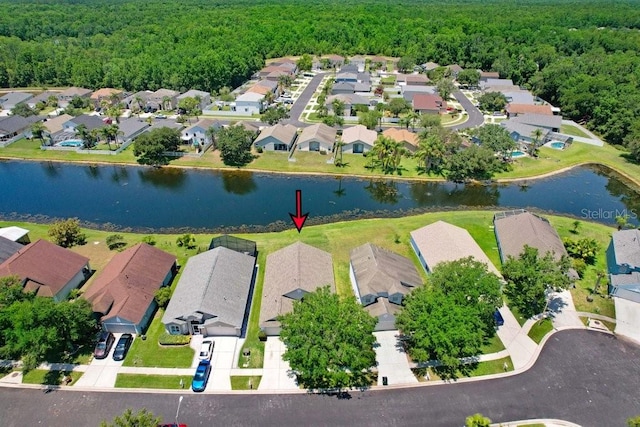 4921 Wessex Way, Land O Lakes, FL 34638 - aerial perspective of suburban area featuring a forest and a nearby body of water