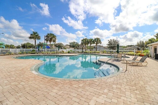 4921 Wessex Way, Land O Lakes, FL 34638 - community pool with a patio