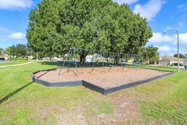 4921 Wessex Way, Land O Lakes, FL 34638 - communal playground featuring a yard