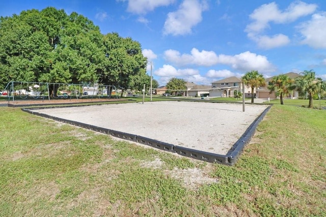 4921 Wessex Way, Land O Lakes, FL 34638 - surrounding community featuring volleyball court, a yard, and a residential view