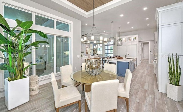 256 Stirling Bridge Dr, Ormond Beach, FL 32174 - dining space with wood finish floors, recessed lighting, a raised ceiling, and a chandelier