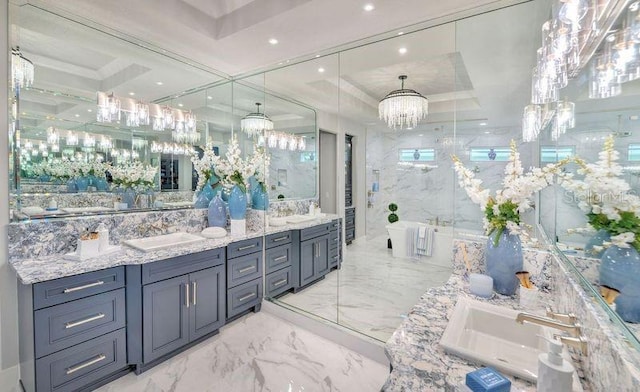 256 Stirling Bridge Dr, Ormond Beach, FL 32174 - full bath with a chandelier, marble finish floors, a soaking tub, double vanity, and a raised ceiling