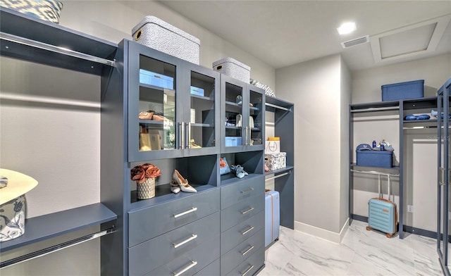 256 Stirling Bridge Dr, Ormond Beach, FL 32174 - spacious closet with light marble finish floors and attic access