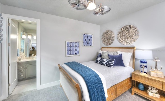256 Stirling Bridge Dr, Ormond Beach, FL 32174 - bedroom with baseboards and connected bathroom