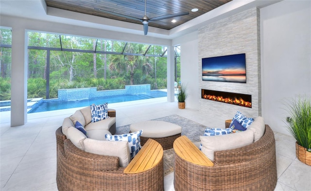 256 Stirling Bridge Dr, Ormond Beach, FL 32174 - view of patio with ceiling fan, an outdoor living space with a fireplace, and an outdoor pool