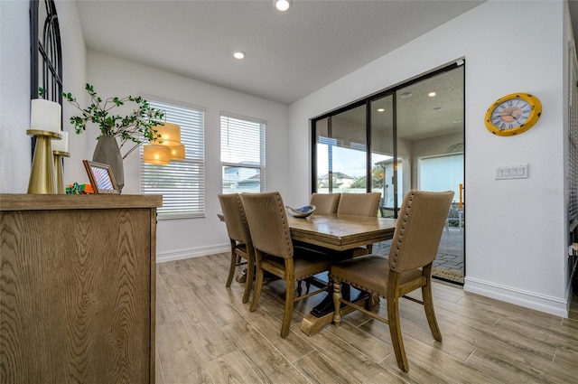 3952 Aldea Way, Wesley Chapel, FL 33543 - dining space featuring baseboards, light wood finished floors, and recessed lighting
