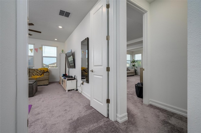 3952 Aldea Way, Wesley Chapel, FL 33543 - hall featuring carpet, plenty of natural light, baseboards, and recessed lighting
