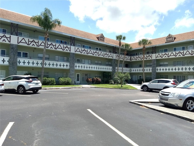 2447 Ecuadorian Way Unit 11, Clearwater, FL 33763 - view of apartment building / complex with uncovered parking