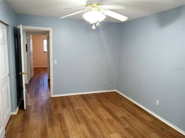 2447 Ecuadorian Way Unit 11, Clearwater, FL 33763 - unfurnished room with wood finished floors, baseboards, and ceiling fan