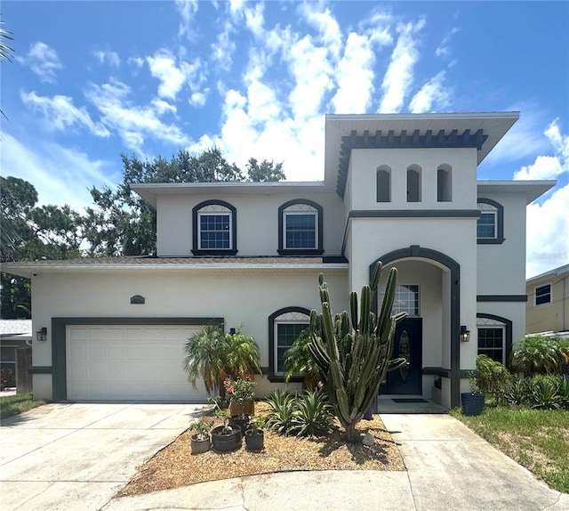 13957 80th Ave, Seminole, FL 33776 - view of front of home featuring stucco siding and concrete driveway