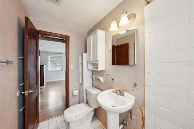 7511 N Ola Ave, Tampa, FL 33604 - half bathroom with toilet and tile patterned floors