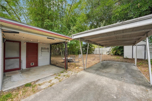 7511 N Ola Ave, Tampa, FL 33604 - view of parking featuring a storage unit