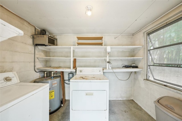 7511 N Ola Ave, Tampa, FL 33604 - laundry room featuring water heater, plenty of natural light, and washing machine and dryer