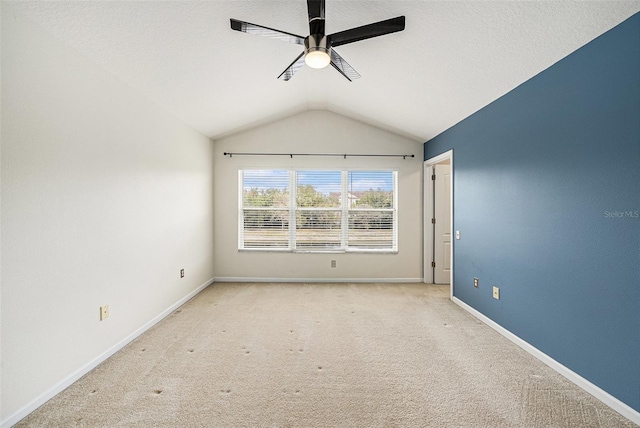 2542 Glenrise Pl, Wesley Chapel, FL 33544 - carpeted spare room featuring a ceiling fan, vaulted ceiling, and baseboards