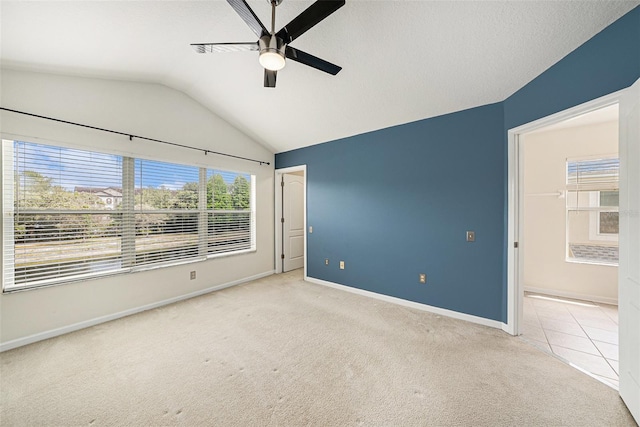 2542 Glenrise Pl, Wesley Chapel, FL 33544 - carpeted empty room with ceiling fan, vaulted ceiling, and baseboards