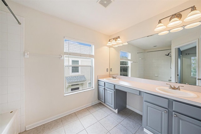 2542 Glenrise Pl, Wesley Chapel, FL 33544 - bathroom featuring double vanity, healthy amount of natural light, tile patterned flooring, and shower / bath combination