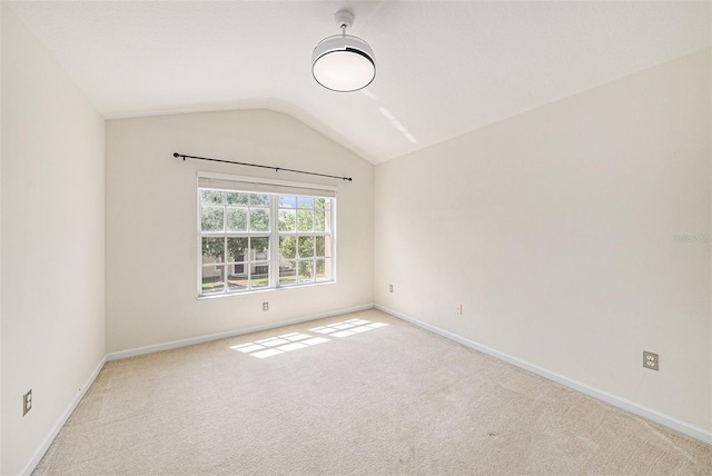 2542 Glenrise Pl, Wesley Chapel, FL 33544 - carpeted spare room with lofted ceiling and baseboards