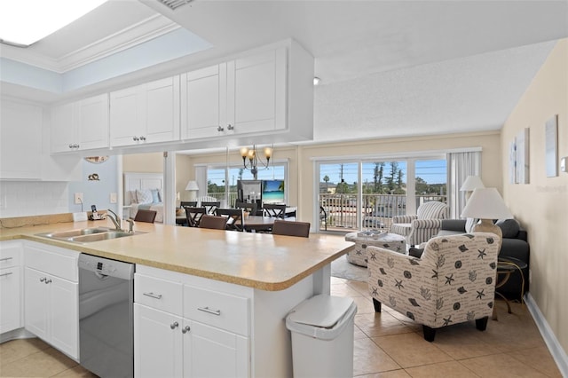 13440 Gulf Blvd Unit 202, Madeira Beach, FL 33708 - kitchen with dishwasher, a peninsula, a sink, light tile patterned flooring, and crown molding