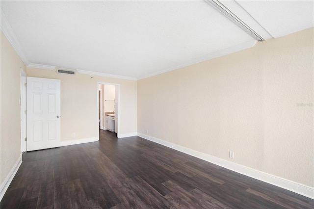 3211 W Swann Ave Unit 605, Tampa, FL 33609 - spare room featuring dark wood-style flooring, baseboards, and ornamental molding