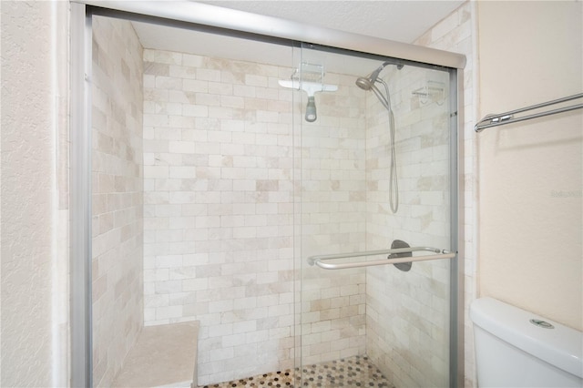 3211 W Swann Ave Unit 605, Tampa, FL 33609 - bathroom with a stall shower and toilet