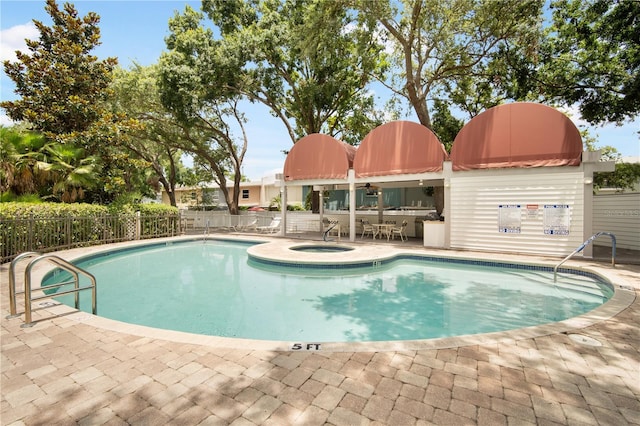 3211 W Swann Ave Unit 605, Tampa, FL 33609 - community pool featuring a patio area and a community hot tub