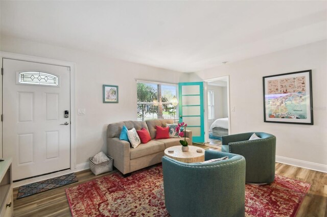 4324 S Clark Ave, Tampa, FL 33611 - living area with wood finished floors and baseboards