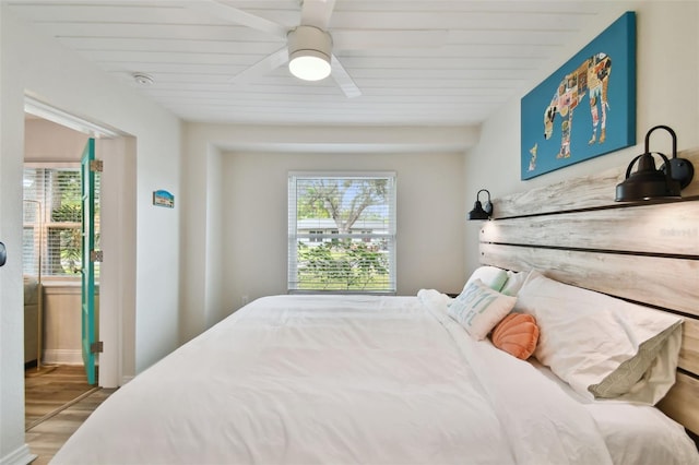 4324 S Clark Ave, Tampa, FL 33611 - bedroom with multiple windows, wood finished floors, and ceiling fan