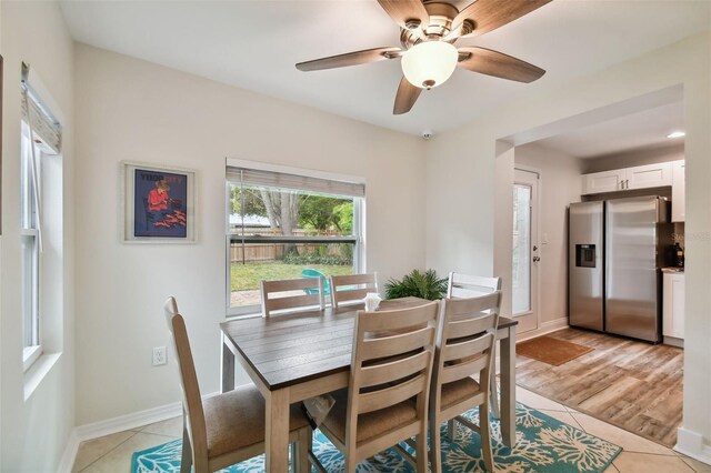 4324 S Clark Ave, Tampa, FL 33611 - dining area featuring light tile patterned floors, baseboards, and a ceiling fan